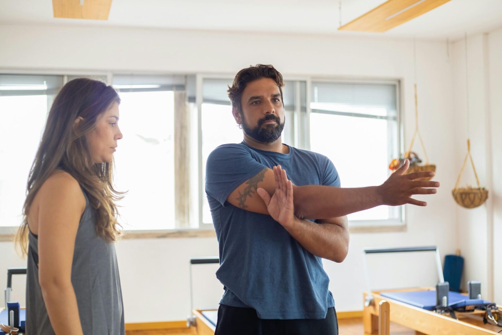A man and woman are holding hands in the gym.
