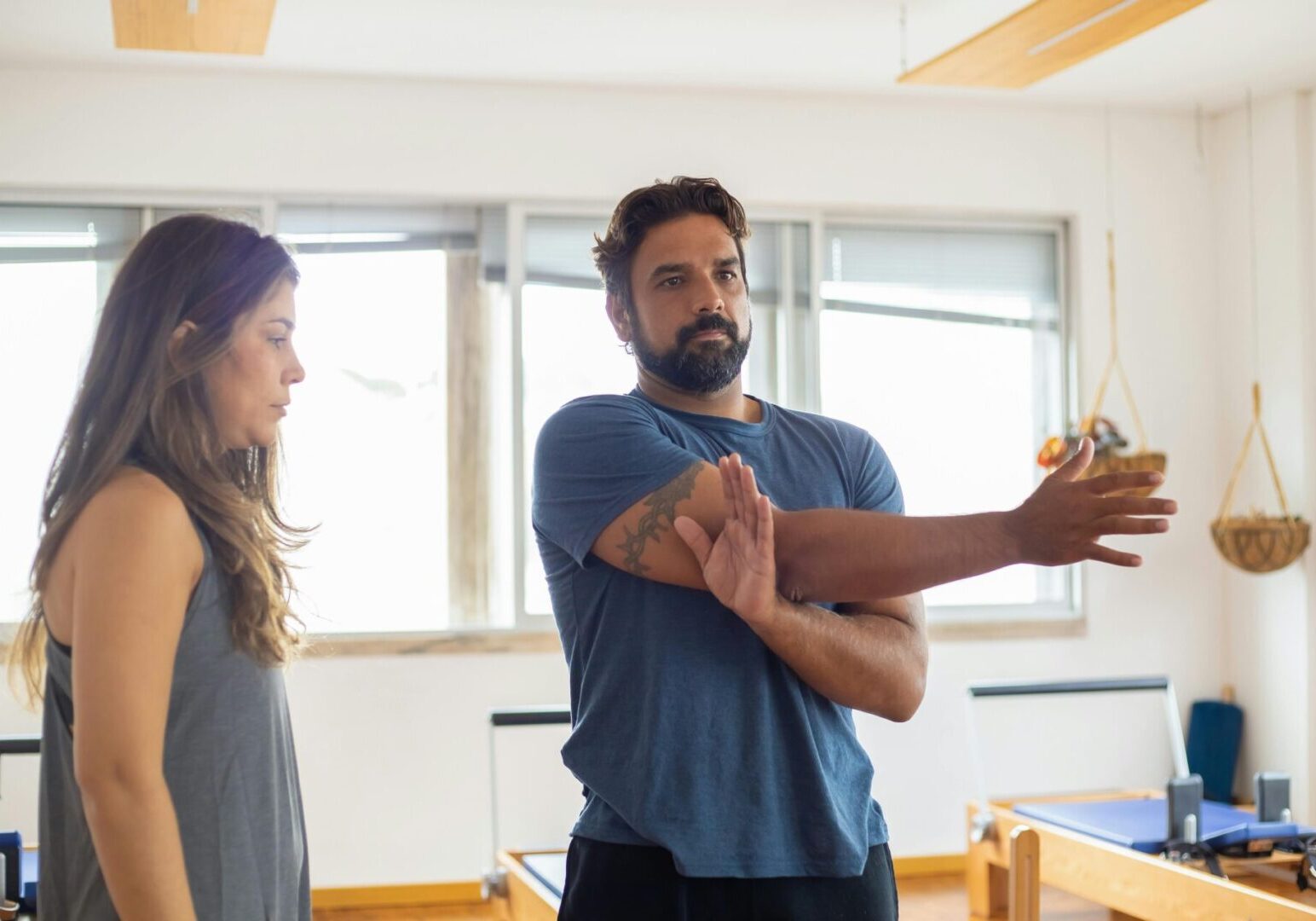 A man and woman are holding hands in the gym.